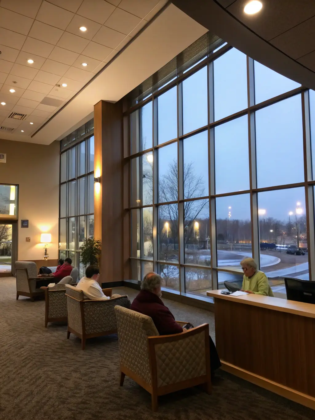 A modern hospital lobby with advanced medical equipment visible in the background, representing VTM Business Solutions' expertise in the Healthcare industry.